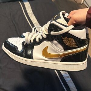 Air Jordan 1 Mid White Black Gold Sneakers